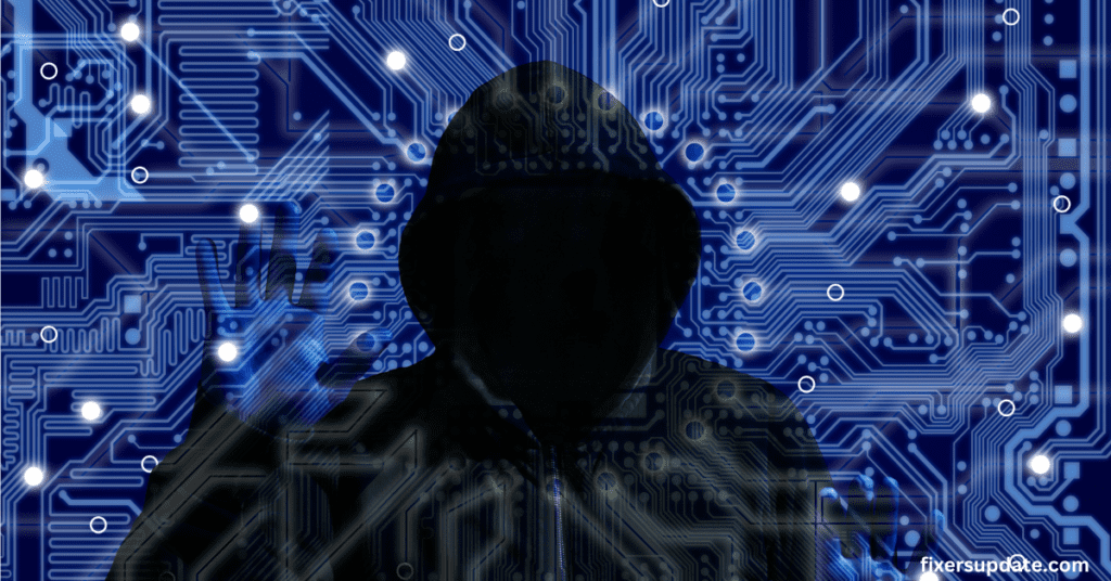 A person wearing a hoodie stands in front of a large circuit board, showcasing technology and innovation from the perspective of a cybersecurity analyst